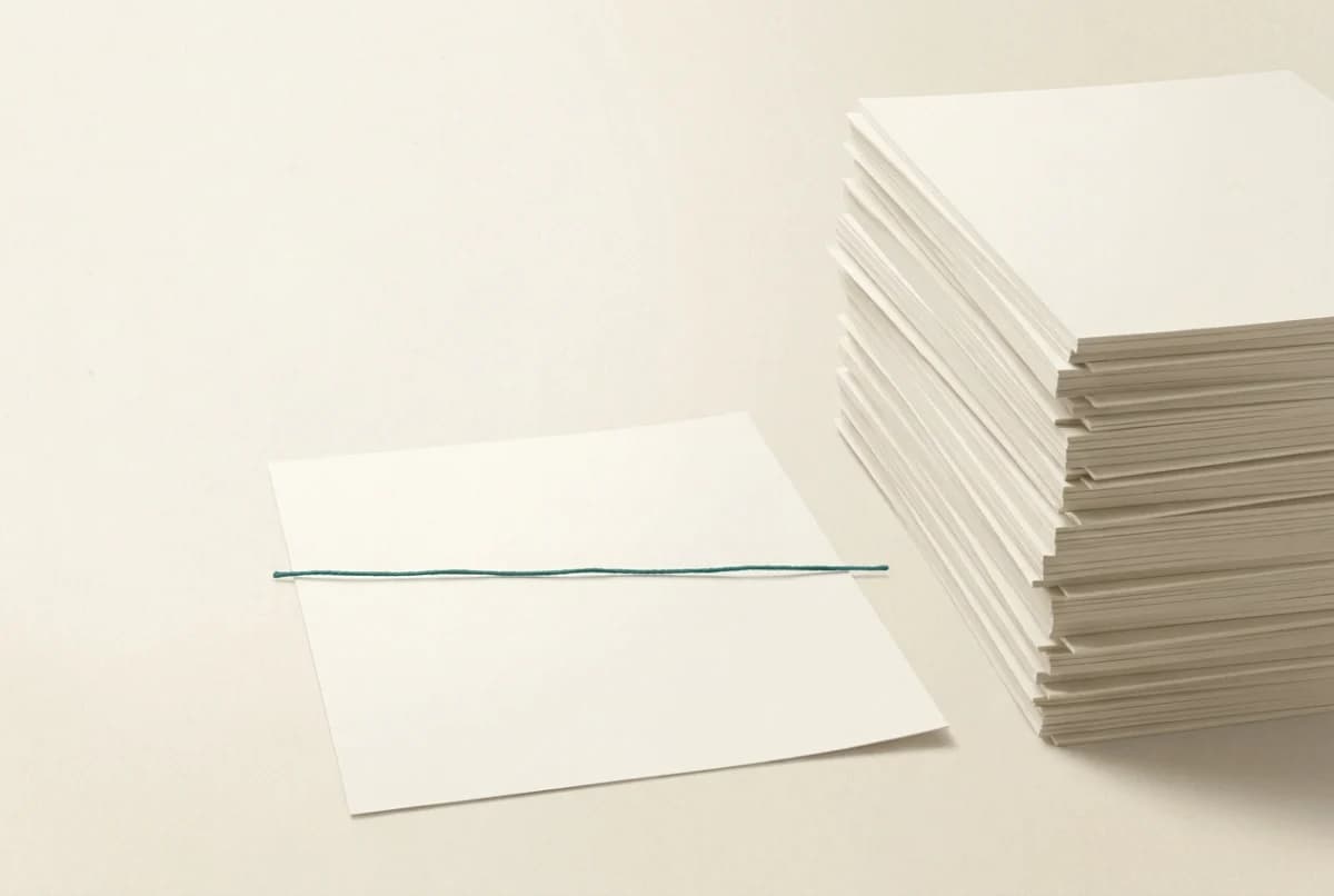 Warm illustration of an intimidatingly tall stack of documents beside which a single teal thread softly illuminates just one line
